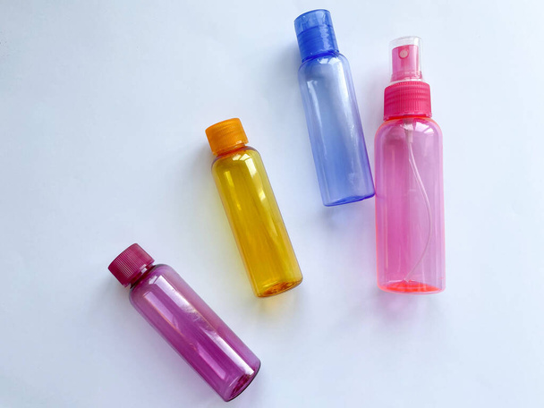 Colorful plastic travel bottles - 写真・画像