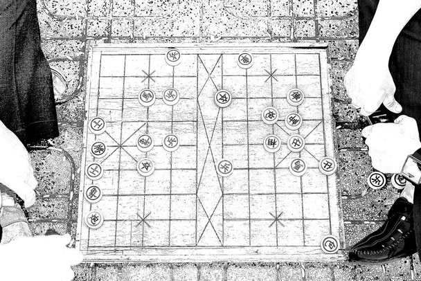 Xiangqi, also called Chinese chess, is a strategy board game for two players. It is one of the most popular board games in China, and is in the same family as international chess, chaturanga, shogi, Indian chess and janggi. - Photo, Image