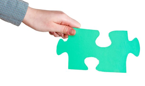 female hand holding big green paper puzzle piece - Photo, Image