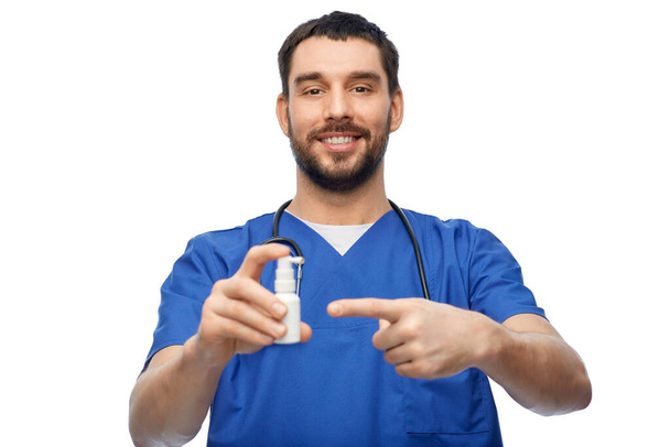 doctor or male nurse with medicine and stethoscope - Foto, imagen