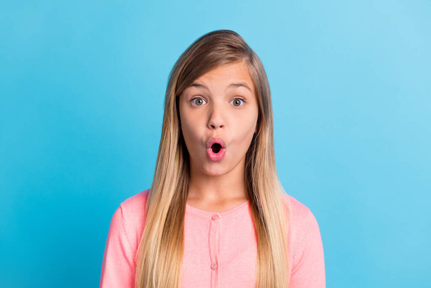 Photo portrait of shocked girl isolated on pastel blue colored background - 写真・画像