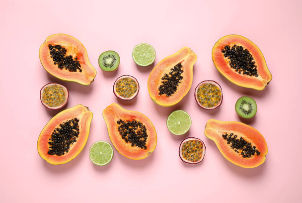 Fresh ripe papaya and other fruits on pink background, flat lay - Φωτογραφία, εικόνα