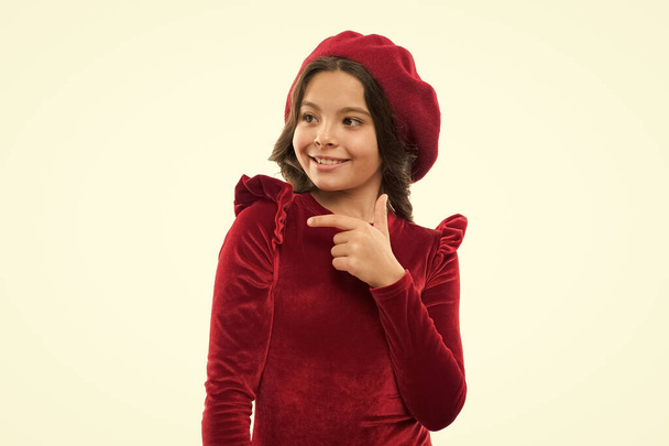 French style child. Parisian girl in beret. Cute girl with dark hair. Stylish brunette. fashion portrait of fashionable girl wearing trendy hat. beautiful happy girl pointing finger. kid from paris - Foto, afbeelding