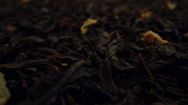 extremely close-up dried black tea leaves background. - Filmmaterial, Video