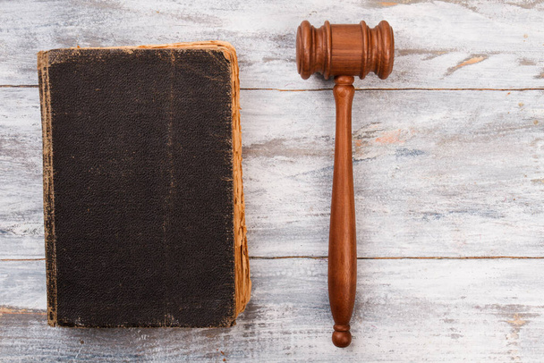 Very old law book and gavel on white wood. - Foto, Imagem
