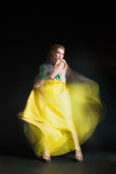 Beautiful woman in long yellow dress - Valokuva, kuva