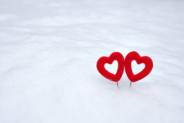 valentine's day background, 2 red velvet hearts on white fluffy snow,  February 14  - Photo, image