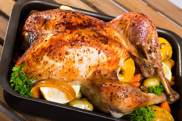 Baked turkey. Rub turkey with salt, pepper, provencal herbs, honey and balsamic. - Фото, изображение