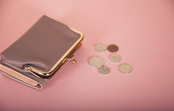 coins with wallet on the wooden table - 写真・画像
