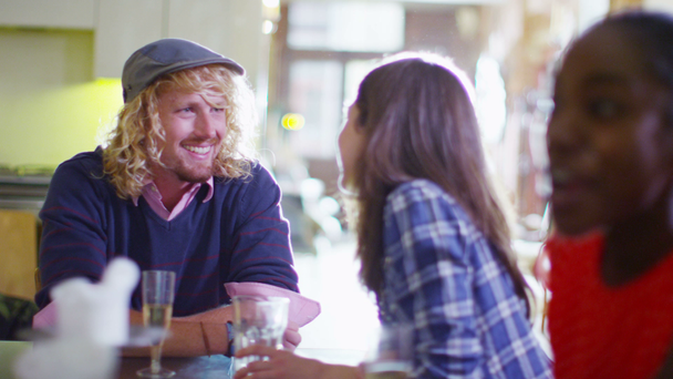 Couple chatting and flirting over drinks - Materiał filmowy, wideo