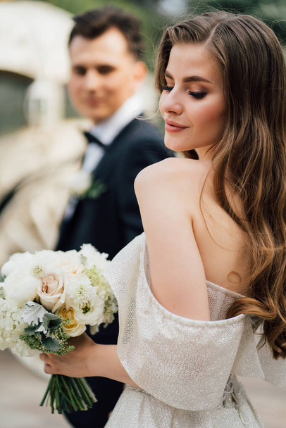 selective focus. The bride holds the grooms hand and follows him.  - Φωτογραφία, εικόνα