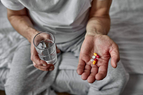 senior man taking pills, closeup. many pills in hands - Φωτογραφία, εικόνα