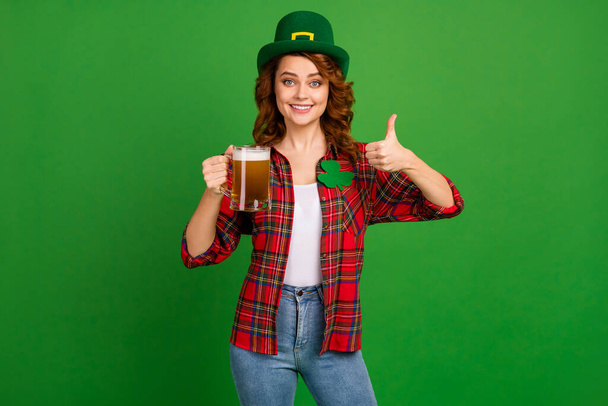 Portrait of her she nice attractive confident pretty glad cheerful cheery wavy-haired girl showing thumbup ad advert advice isolated over bright vivid shine vibrant green color background - Foto, Bild