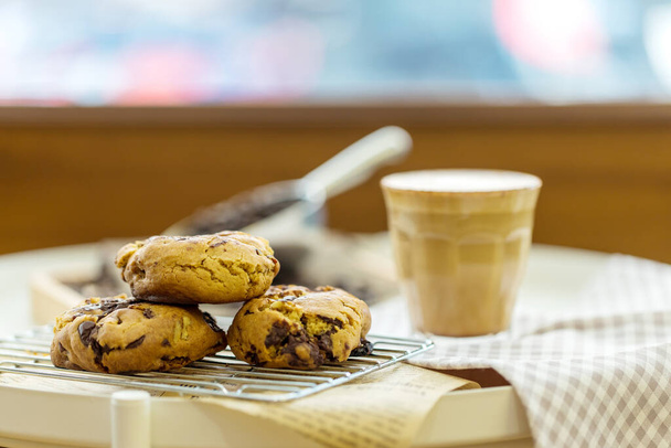 Oatmeal cookies on table. Chocolate chip cookies. Healthy food and drink and natural diet food. Cookie Almond and Cashew nuts. - 写真・画像