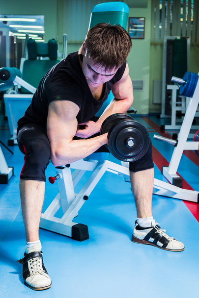Man exercising with dumbbell - 写真・画像