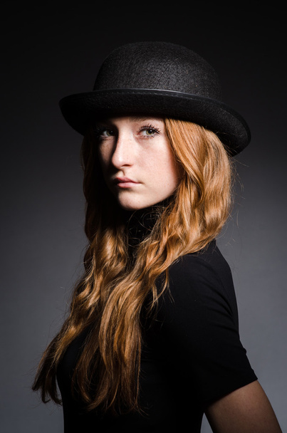 Redhead girl in hat - Фото, изображение
