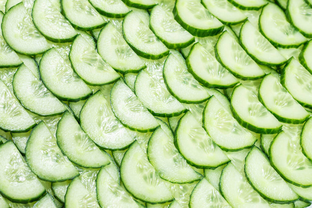 Fresh green slices of cucumber as background. Top view.  - Photo, Image