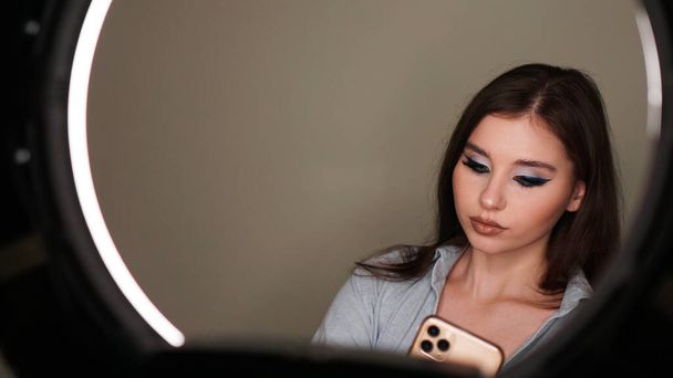 Young attractive model make a selfie after makeup in beauty studio - Foto, Imagem