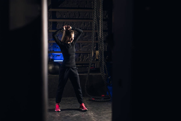 Young girl stands in an atmospheric gym. Sport - Photo, image