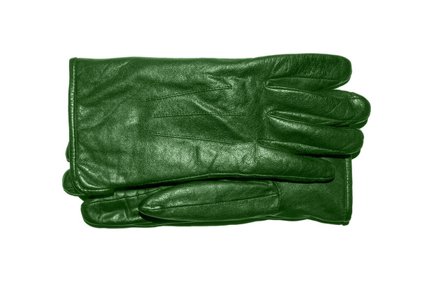 Пара зелених шкіряних рукавичок на білому тлі.Шкіряні рукавички вид зверху.Шкіряні рукавички студійне фото
. - Фото, зображення
