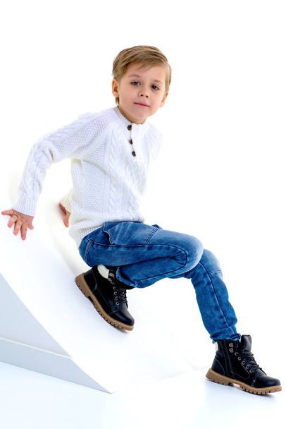 Boy posing in studio against white background. - Fotó, kép