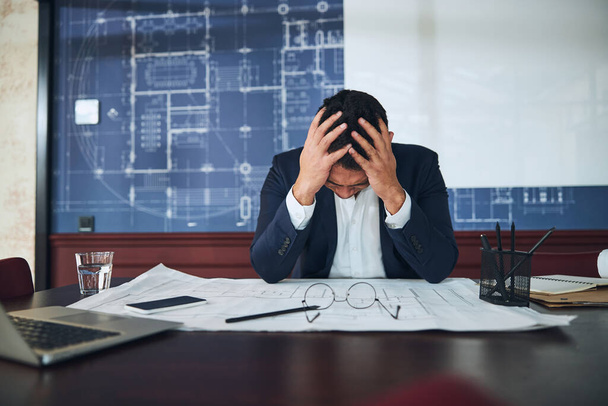 Employee having a bad headache at work - Photo, Image