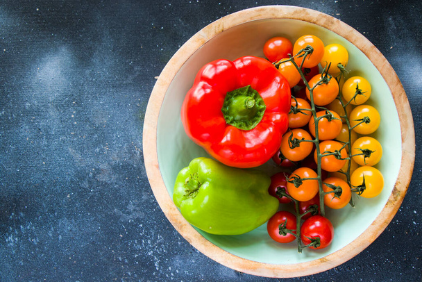 All color bell pepper, green spacy pepper and cherry tomatoes, colorful vegetables background, raw ingredients - Photo, Image