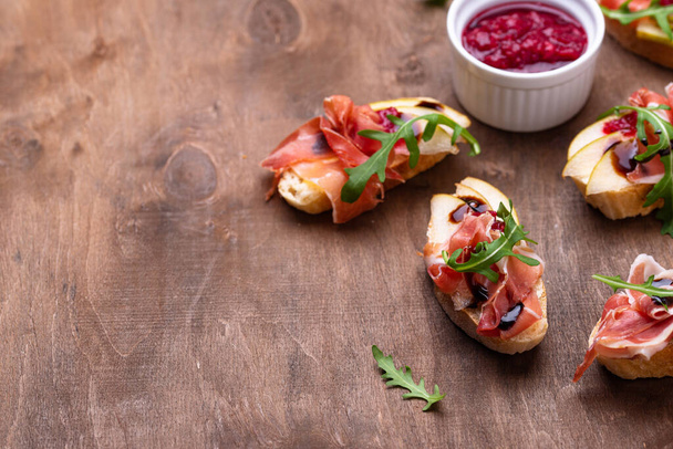 Toasts with pear and prosciutto - Photo, Image