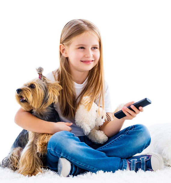 Girl and her dog switching channels - Foto, Bild