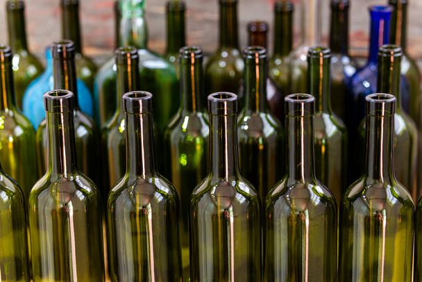 Empty foreground bottles of colors and alcohol for decoration - Photo, Image