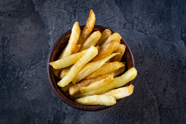 Bowl filled with french fries - Fotó, kép