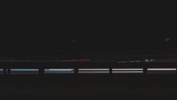 Super fast cars lights. Night motion time lapse. Hyper speed loop of urban movement. Minimal background texture. Blurred night street road traffic of modern cityscape.  - Footage, Video