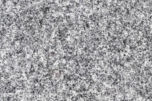 Close-up van grijze granieten steen, textuur achtergrond    - Foto, afbeelding
