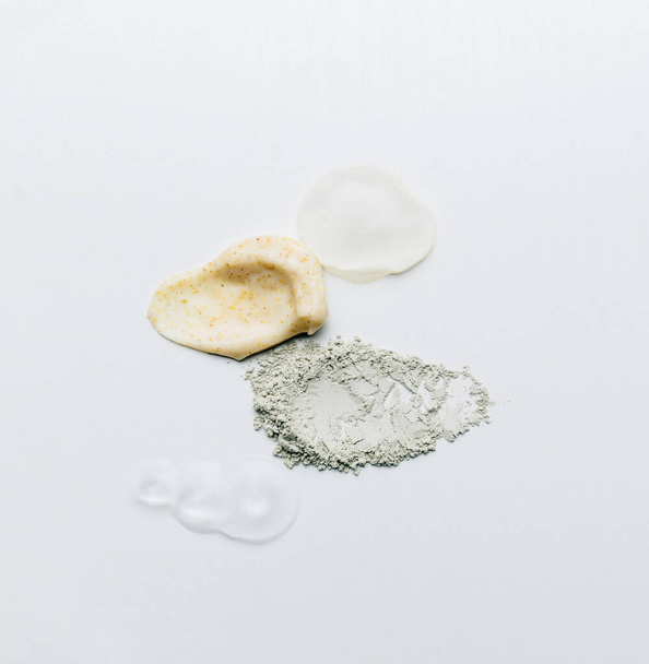 Textures from cosmetics and powder. Body Scrub. Smears on the table - Foto, imagen