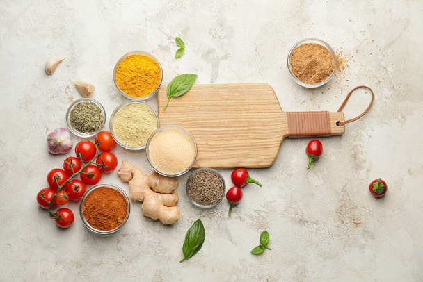 Composition with different spices and tomatoes on light background - Foto, Imagem