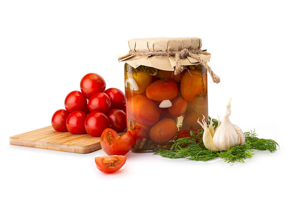 Preserved tomatos in glass jars. Isolated on white background - Fotografie, Obrázek