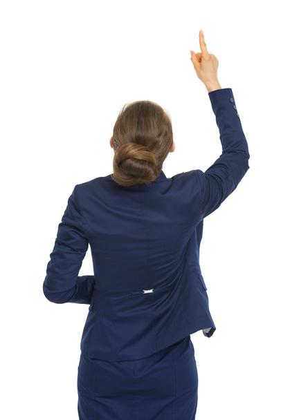 Business woman pointing up - Foto, afbeelding