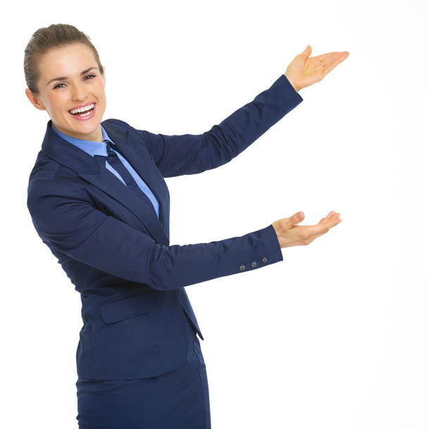 Business woman pointing on copy space - Фото, изображение