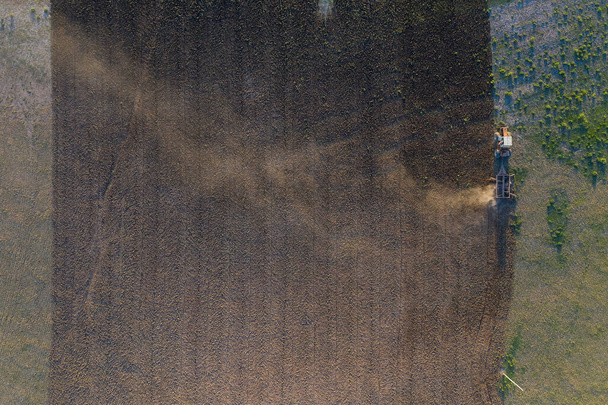 Tractor plowing the field, Pampas countryside, La Pampa, Argentina. - Photo, Image