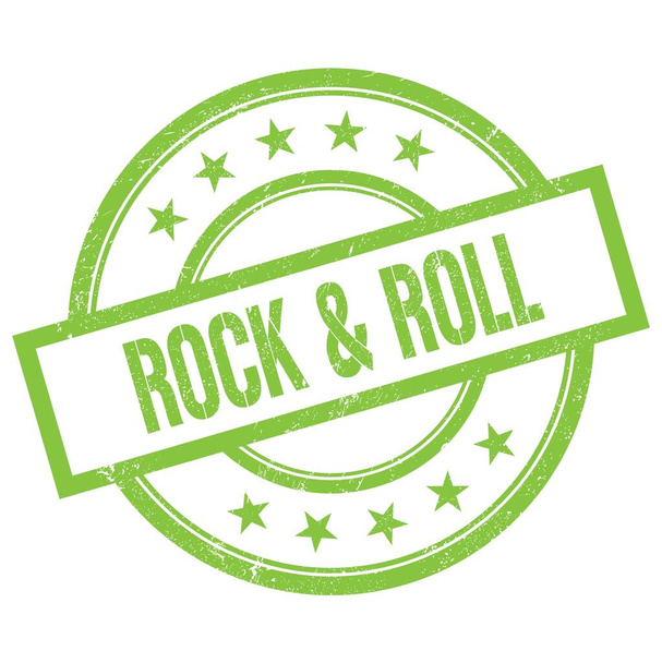 Текст ROCK & ROLL написан на зеленой круглой резиновой марке. - Фото, изображение