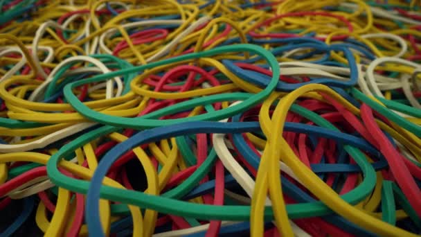 close-up colorful ring shaped rubber bands background - Footage, Video