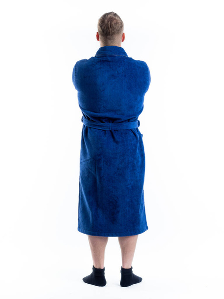 man in a Bathrobe from the back on an isolated white background. Shot in the Studio in full growth. - 写真・画像
