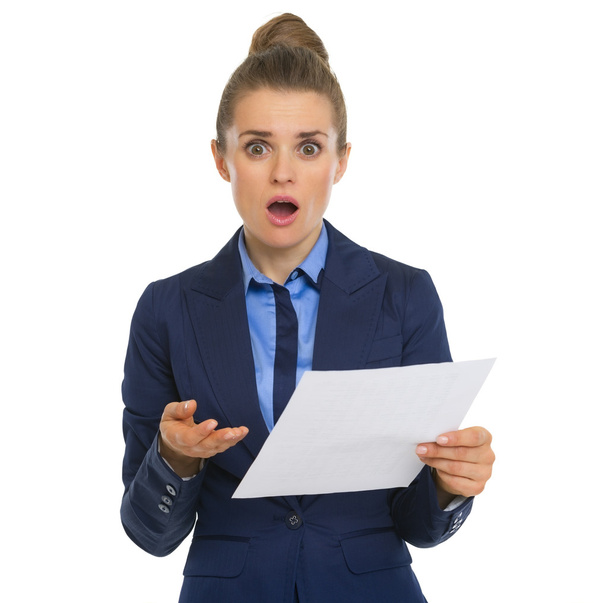 Concerned business woman with document - Foto, imagen