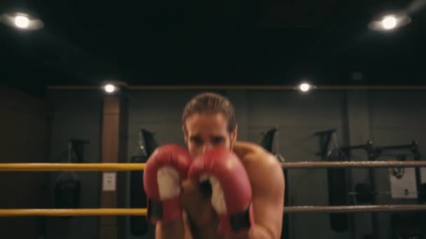 slow motion of hispanic shirtless boxer exercising on boxing ring  - Кадры, видео