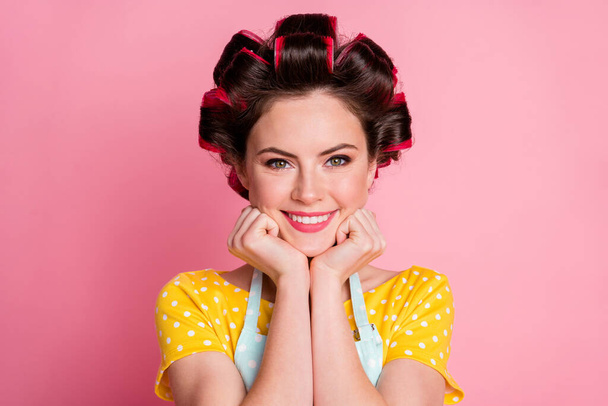 Close up photo of cheerful lady with curlers feel grateful wear retro clothes isolated over pastel color background - 写真・画像