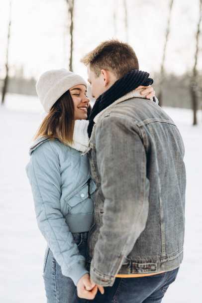 A couple walks in the winter. Couple in love. Snow. Winter. - Photo, Image
