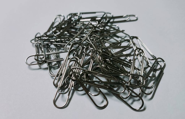 some paper clips on a white background - 写真・画像
