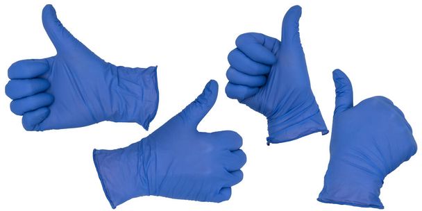 Mão vestindo luva de exame de nitrilo azul faz um gesto polegar para cima. Vários ângulos - Foto, Imagem