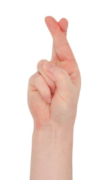 Sproeten witte hand. Hand maken van de vingers gekruist gebaar, uitzicht van voren. Vrouwelijke hand geïsoleerd - Foto, afbeelding