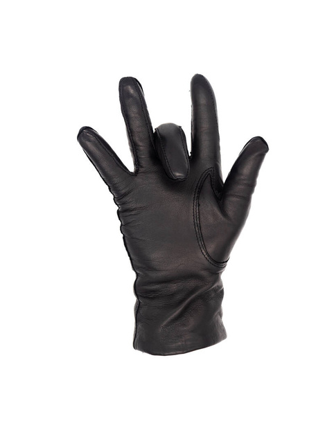 Рука ізольованої жінки носить чорну шкіряну рукавичку вгору, а середній палець лише відкинутий
 - Фото, зображення